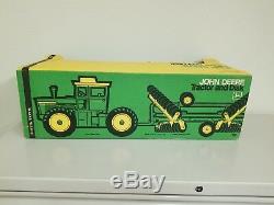 Ertl John Deere 7520 four wheel drive tractor and disk set. New in box. NIB