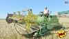 John Deere 800 Windrower Harvesting Wheat