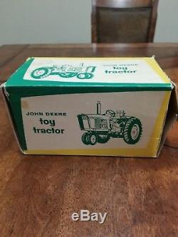 Vintage Ertl John Deere 3010 tractor in box. 4 lever, 3 point, metal rims